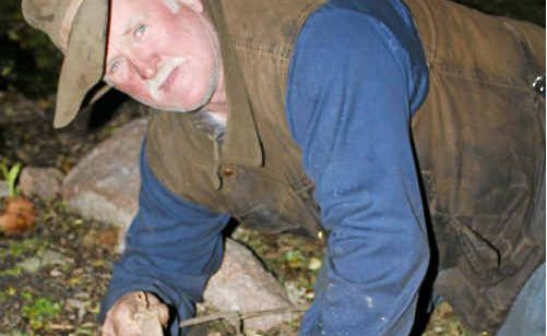 Dalveen property owner Jim Mitchell stands over a dung-hole. Dalveen property owner Jim Mitchell stands over a dung-hole.
